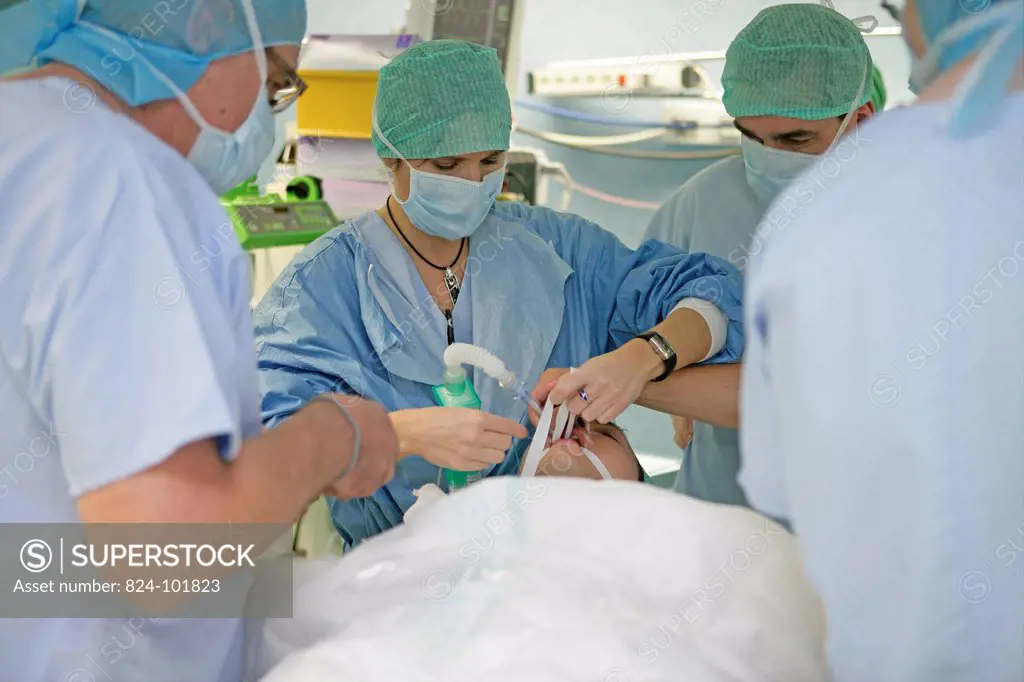 Photo essay at Rouen hospital, France. Plastic surgery. Skin grafting on the thorax of a man, the transplant is taken from the thigh of the patient. H...