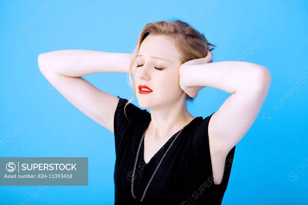 Woman suffering from earache.