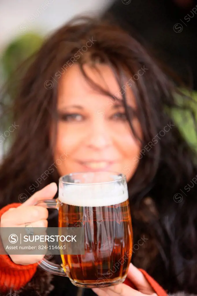 Woman drinking beer.