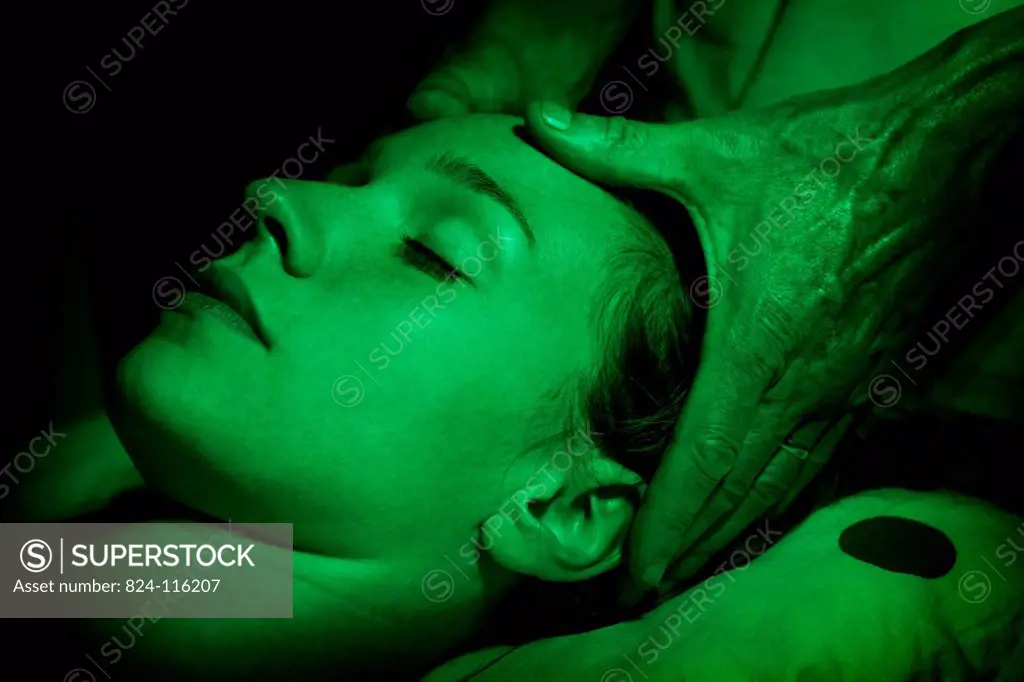 Reportage in the Chrysalide wellness centre in France that specialises in chromotherapy. A patient is massaged by Dr Bourdin while receiving chromothe...