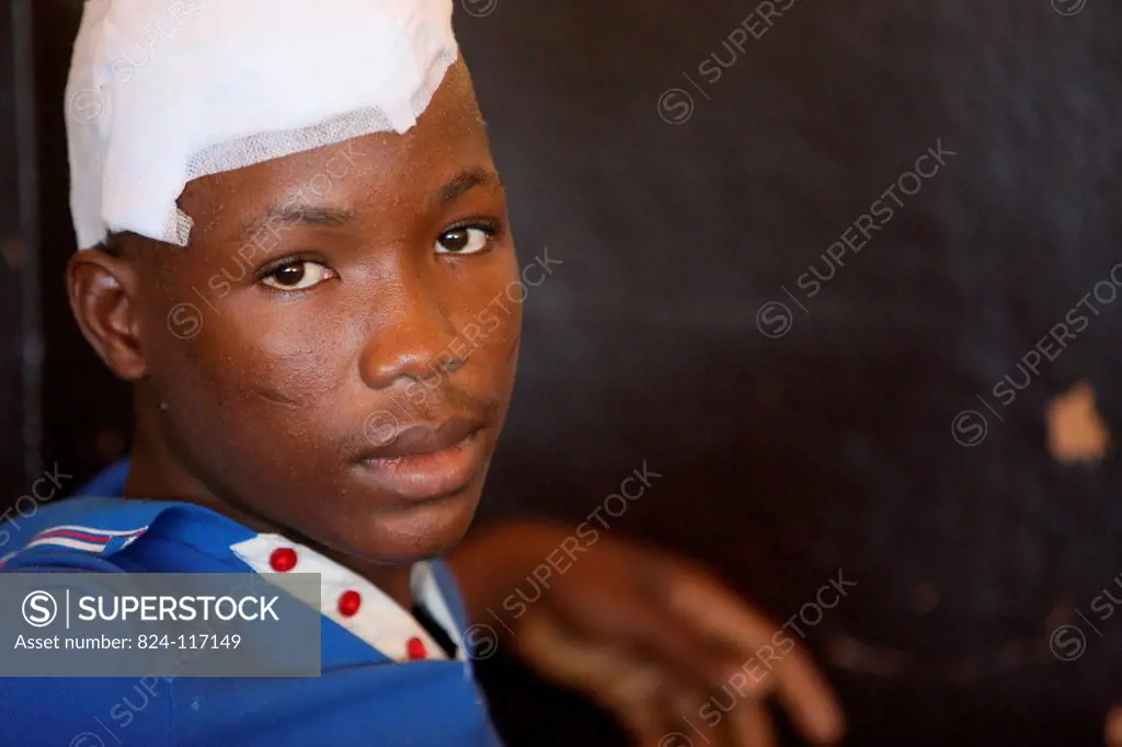 Photo essay in Lomé, Togo. Young patient in an African hospital. Department of neurosurgery.