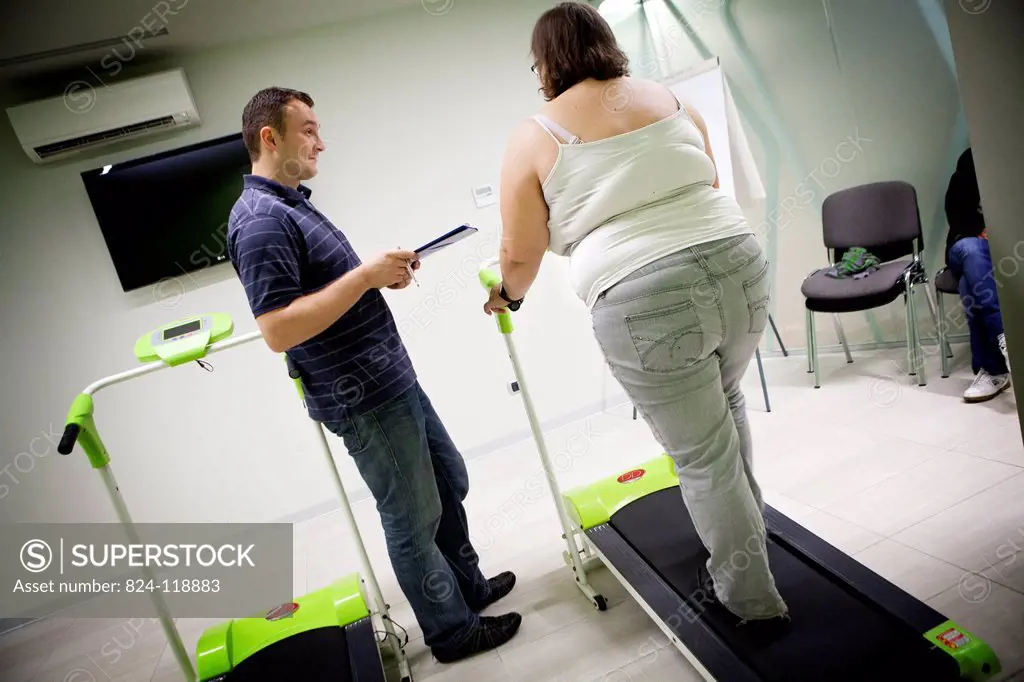Reportage in the Obesity Clinic IPCO in Mulhouse, France. Physical exercise session with a masseur_physiotherapist. Patients must attend these session...