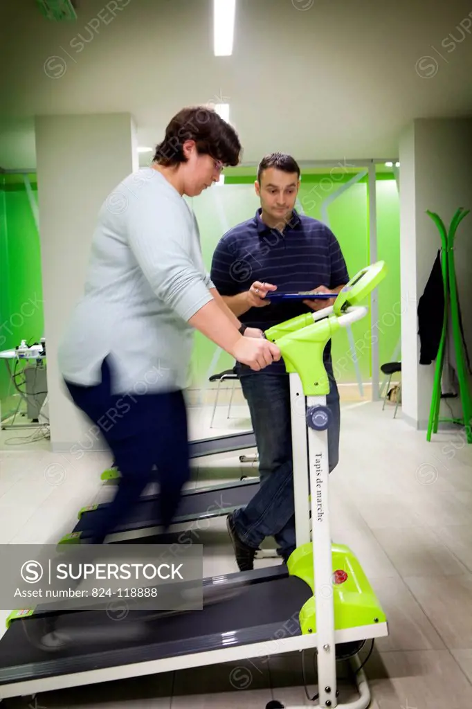 Reportage in the Obesity Clinic IPCO in Mulhouse, France. Physical exercise session with a masseur_physiotherapist. Patients must attend these session...