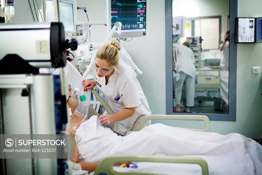 Reportage in Robert Ballanger hospital's Intensive Care Unit in France. A nurse talks to a patient who has just been extubated.