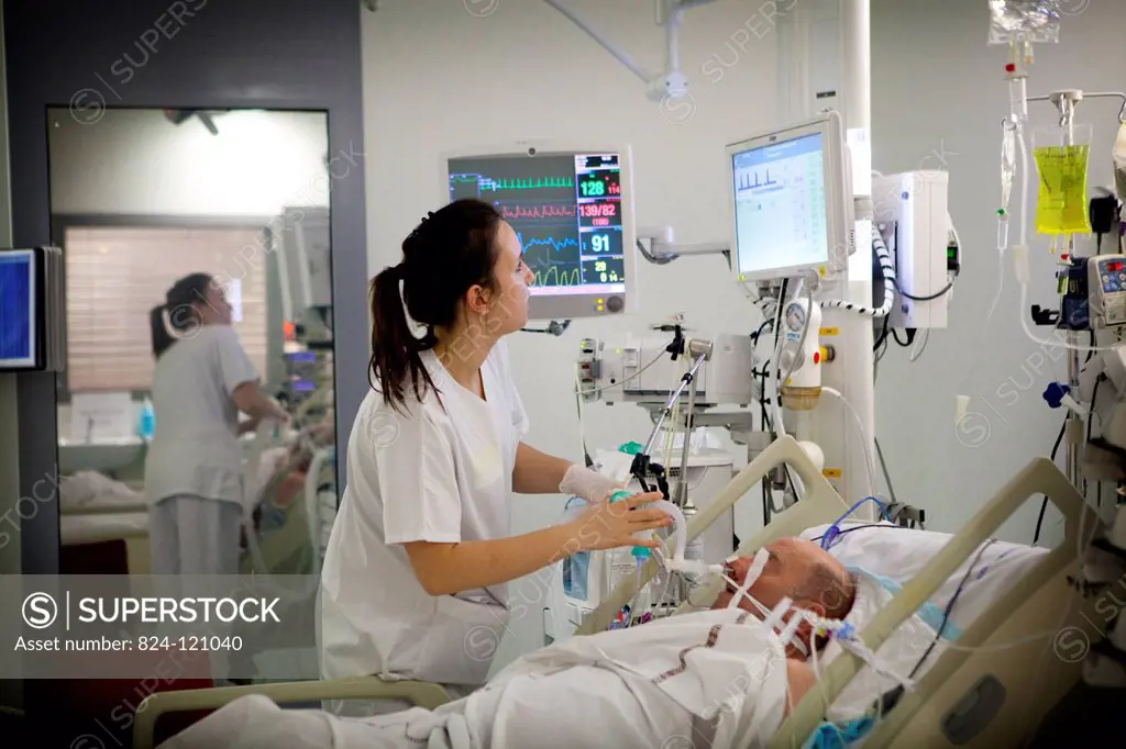 Reportage in Robert Ballanger hospital's Intensive Care Unit in France. A student nurse checks the flow of oxygen.