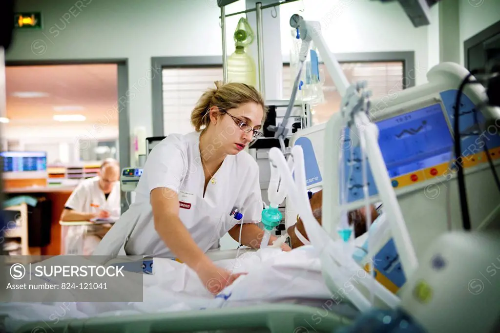 Reportage in Robert Ballanger hospital's Intensive Care Unit in France. A nurse talks to a patient.