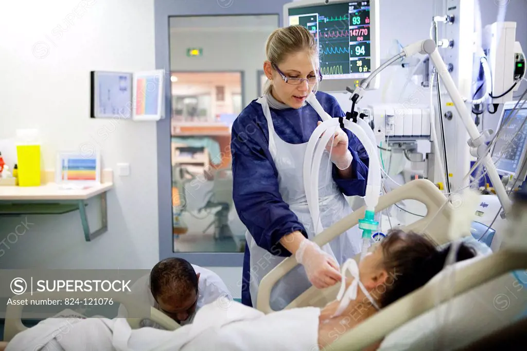 Reportage in Robert Ballanger hospital's Intensive Care Unit in France. A nurse talks to a patient.