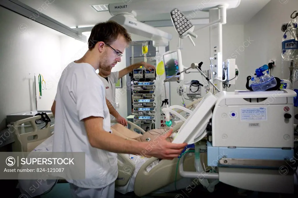Reportage in Robert Ballanger hospital's Intensive Care Unit in France. An intern in a patient's room.
