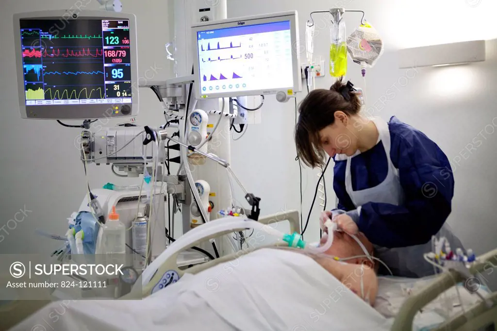 Reportage in Robert Ballanger hospital's Intensive Care Unit in France. A nurse cleaning an intubation tube.