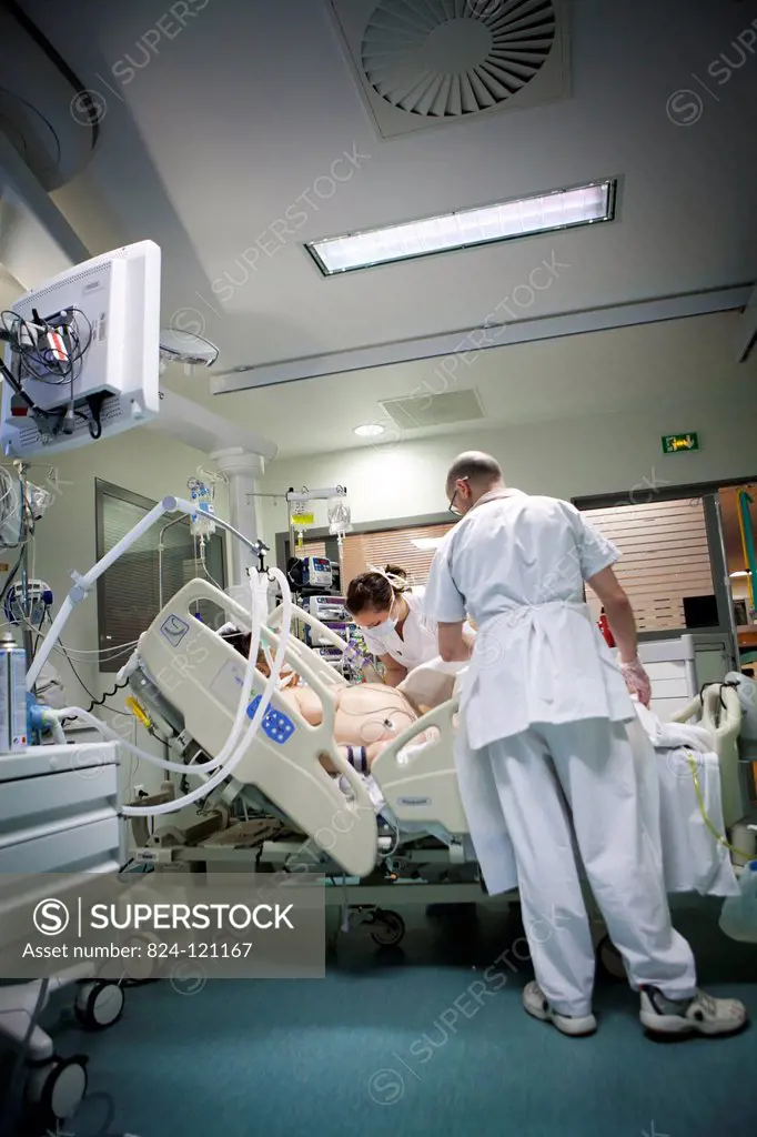 Reportage in Robert Ballanger hospital's Intensive Care Unit in France. A nurse and nursing auxiliary looks after a patient.