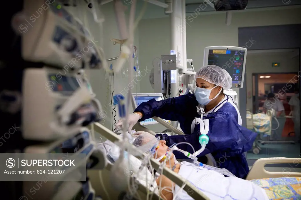 Reportage in Robert Ballanger hospital's Intensive Care Unit in France. a nursing auxiliary looks after a patient.