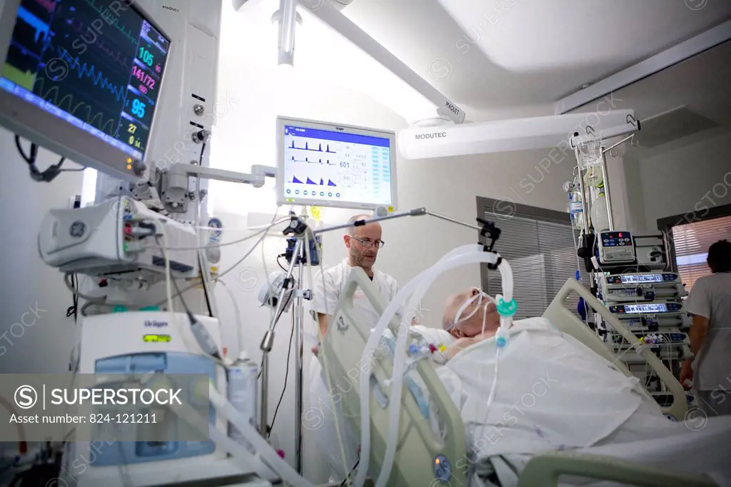 Reportage in Robert Ballanger hospital's Intensive Care Unit in France. A nursing auxiliary looks after a patient.