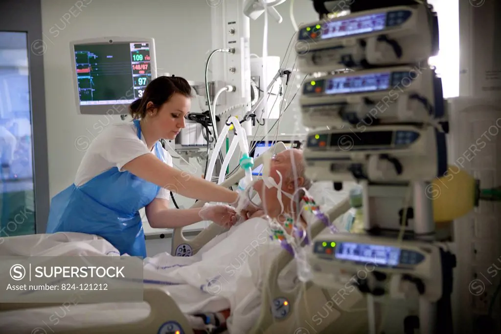 Reportage in Robert Ballanger hospital's Intensive Care Unit in France. A nurse looks after a patient.