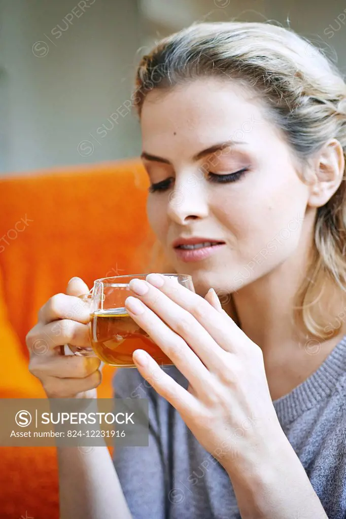 Woman drinking tea.