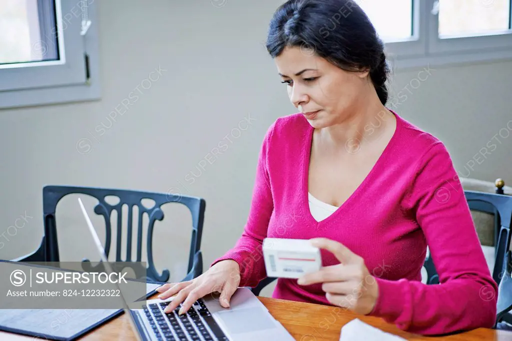Woman reading medical informations on the internet.
