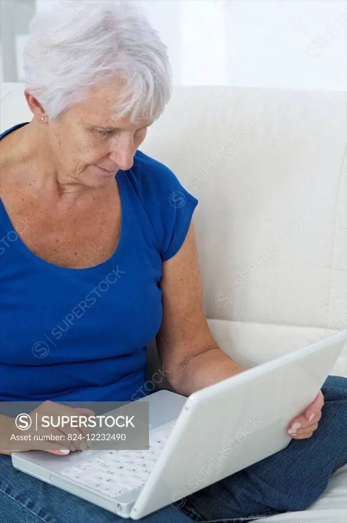 Senior woman using laptop computer.
