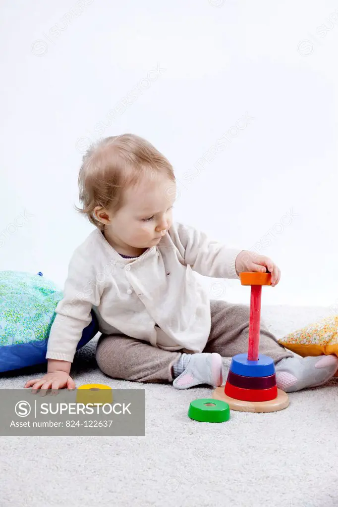 INFANT PLAYING INDOORS