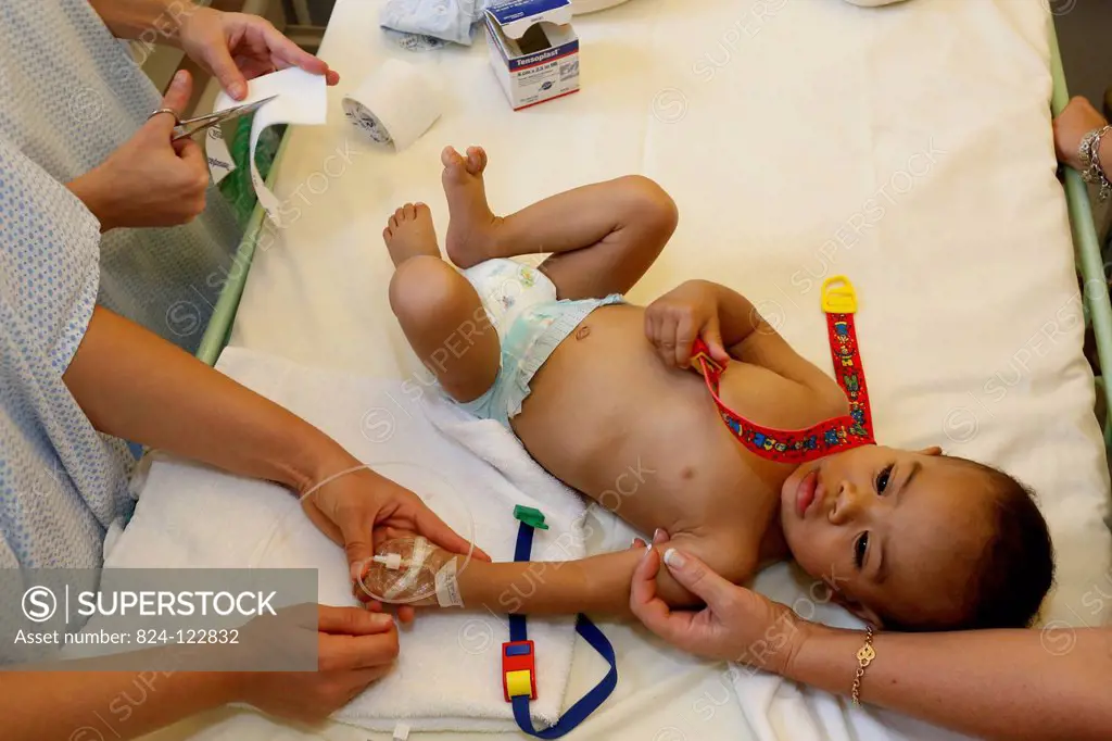 Child in hospital with his foster mother. This boy from Madagascar is about to undergo heart surgery provided by French NGO La Chaine de l'Espoir (Sur...