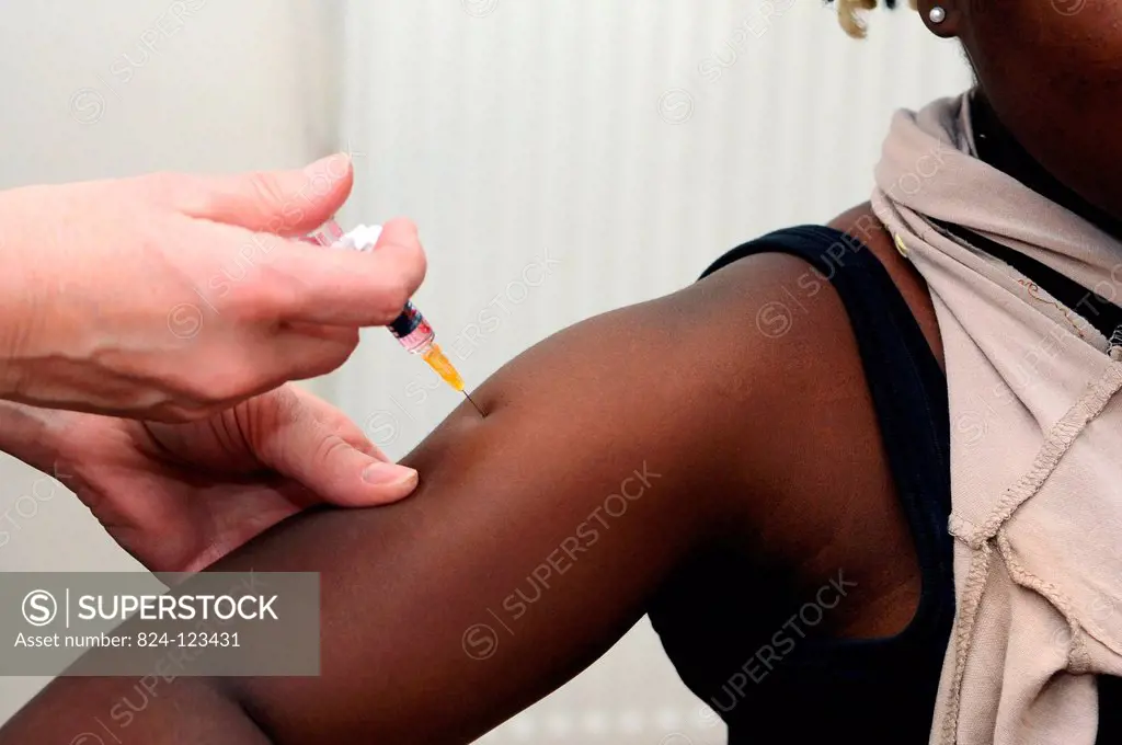Reportage in the Health and Prevention Centre run by the local committee for social hygiene (CDHS) in Lyon, France. MMR vaccination. Priorix immunises...