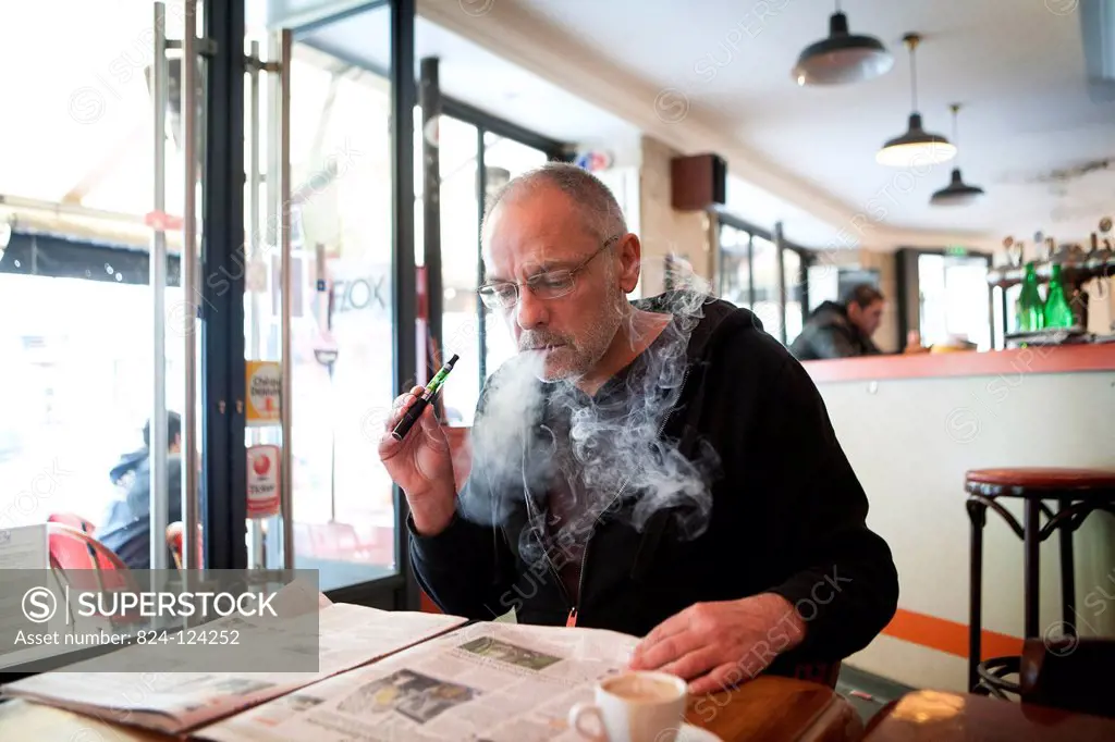 Man with an electronic cigarette in a public place.