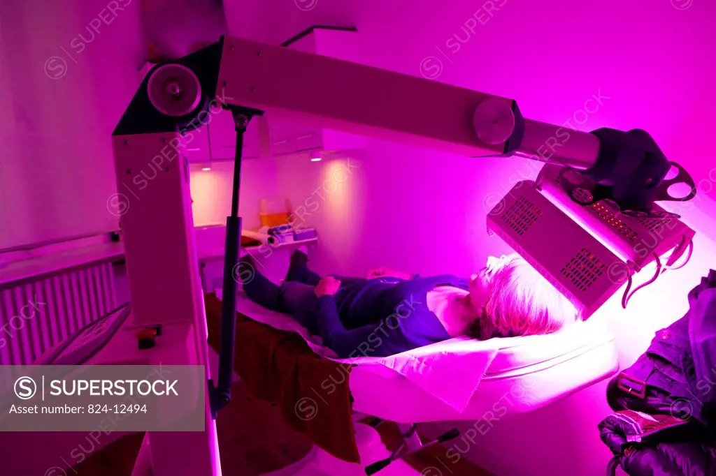 Photo essay in a aesthetic medicine office France. Spectrum LED cold light skin therapy is a non_invasive procedure activating skin cells with low_lev...