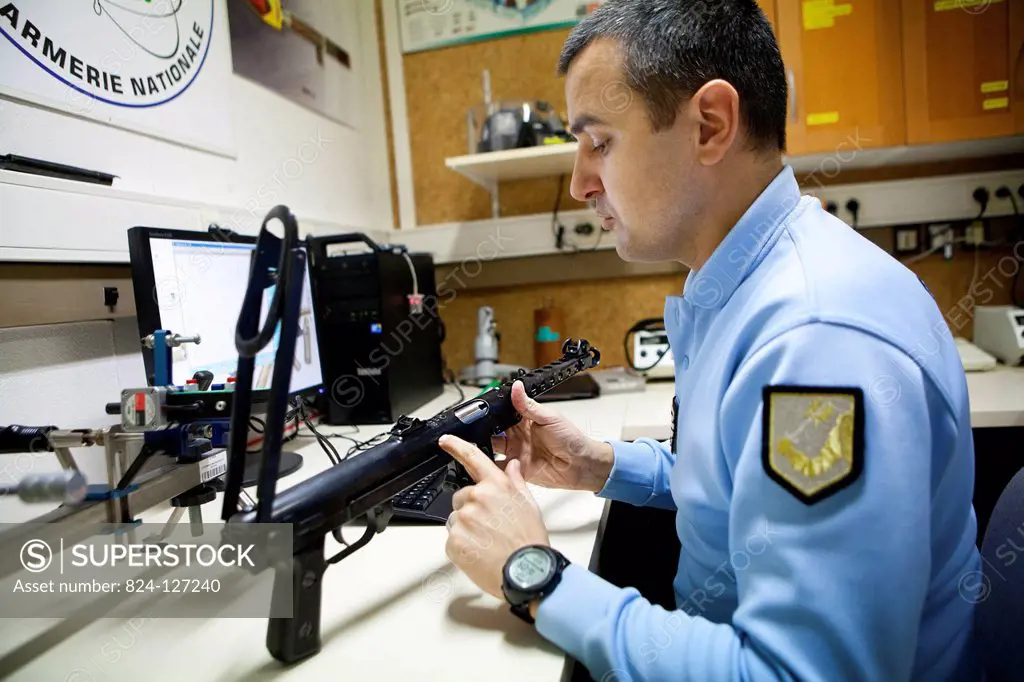 Reportage in the French National Police's Criminal Research Institute in Rosny-sous-Bois, France. Ballistics Department. Determining the level of resi...