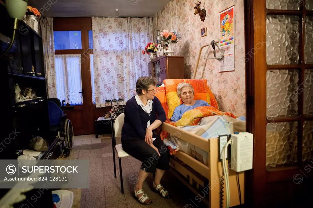 Reportage on family carers. A family carer is a person who helps someone in their family when they lose their autonomy, due to illness or old age. Mar...