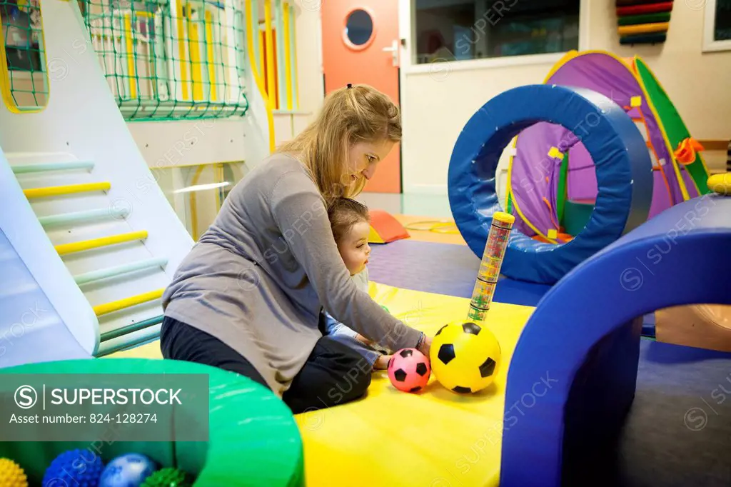 Reportage on a psychomotor specialist practising in a day nursery in Paris, France. This small 2-year old boy has a delayed growth rate and has psycho...