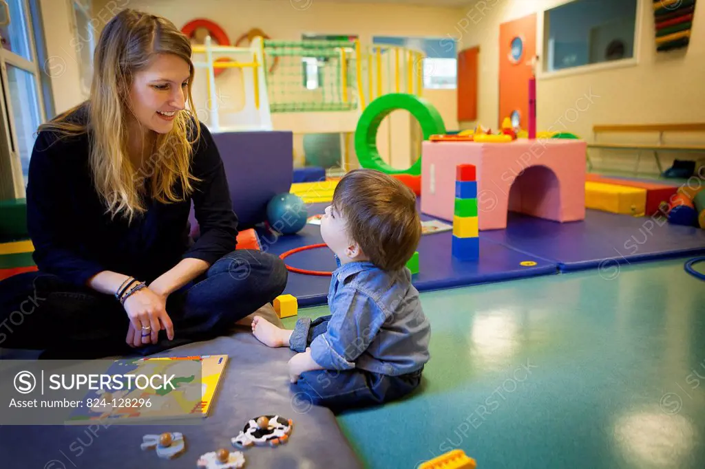 Reportage on a psychomotor specialist practising in a day nursery in Paris, France. This small 2-year old boy has a delayed growth rate and has psycho...