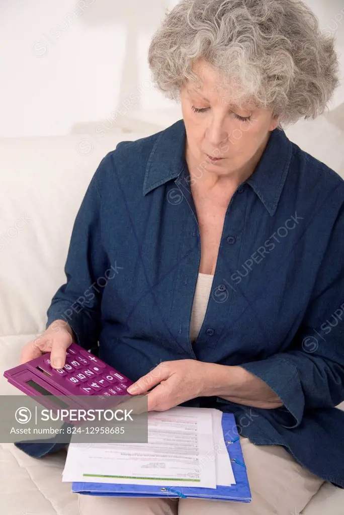 Senior woman doing paperwork.