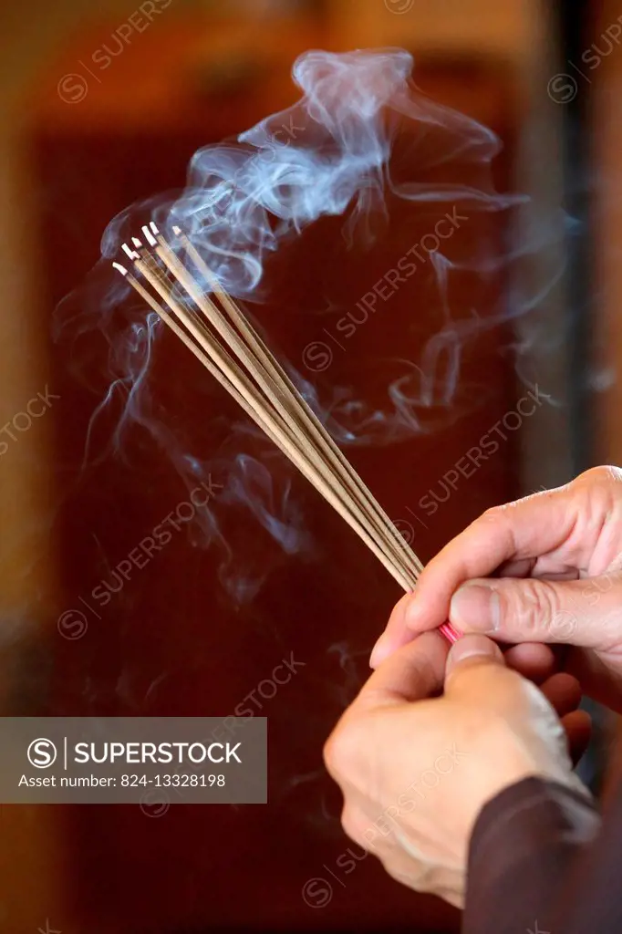 Fo Guang Shan temple. Burning incense sticks.