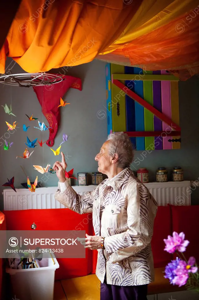 Reportage in a snoezelen room in Liège. Mony, 85, who has Alzheimer´s disease, moves around in this multi_sensory environment, which is both soothing ...