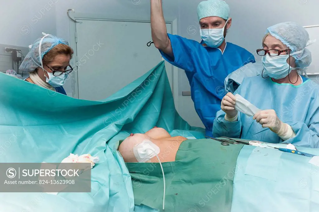 Reportage in the Mozart plastic surgery clinic in Nice, France. Fitting breast implants using the round block technique. The operation is finished: re...