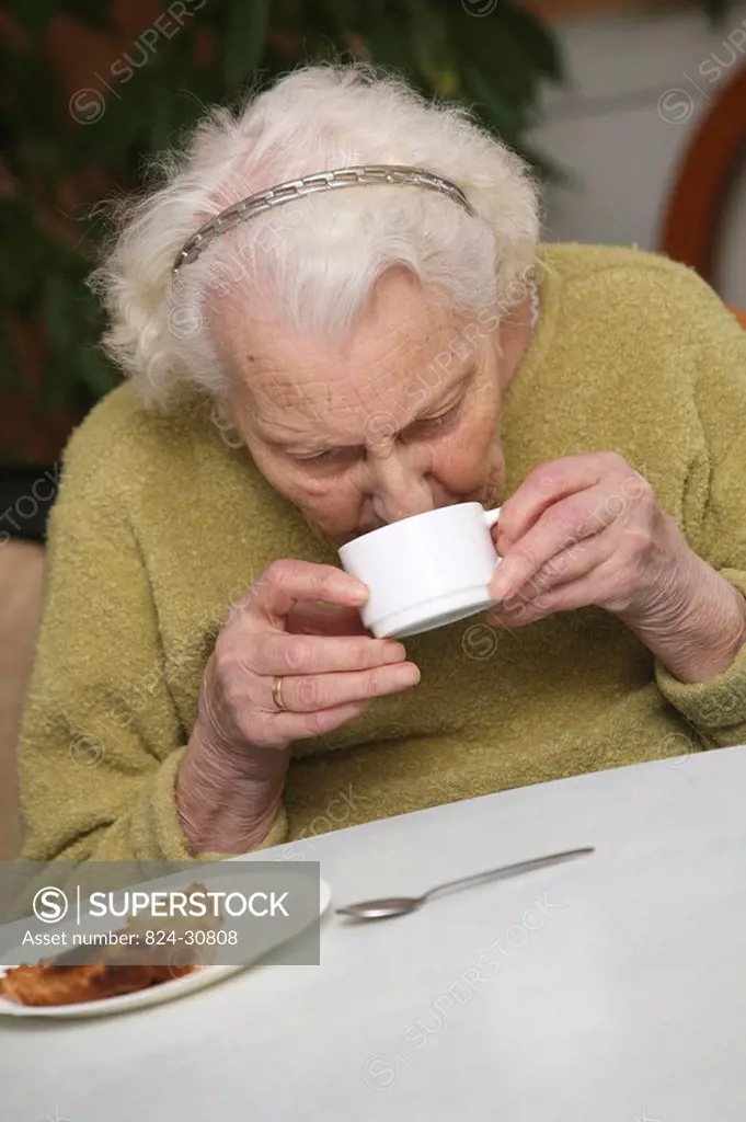 HOME FOR THE AGED Photo essay in a nursing home for the elderly in the department of Aisne, France. Retired woman having her afternoon tea.