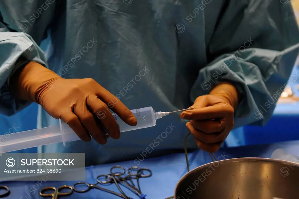 Photo essay at Lyon hospital. Department of urology. Surgical treatment of erectile dysfunction with a penile prosthesis. Preparation of the prosthesi...
