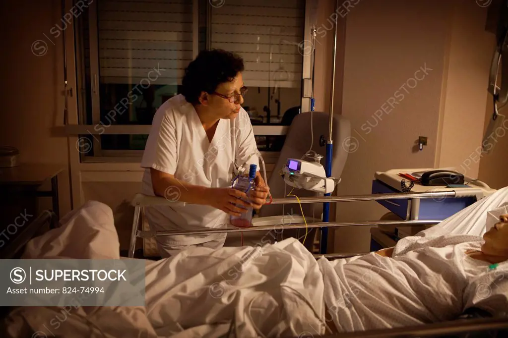 Photo essay at La Croix Saint_Simon Hospital, Paris, France. Night nurse.