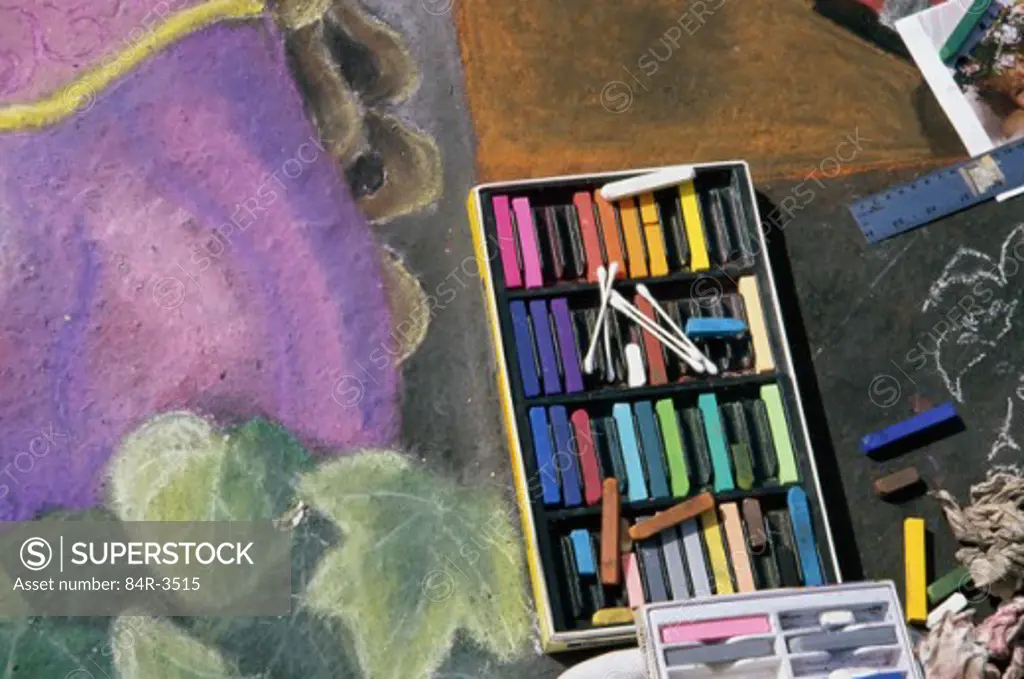 Close-up of colored chalk in a box