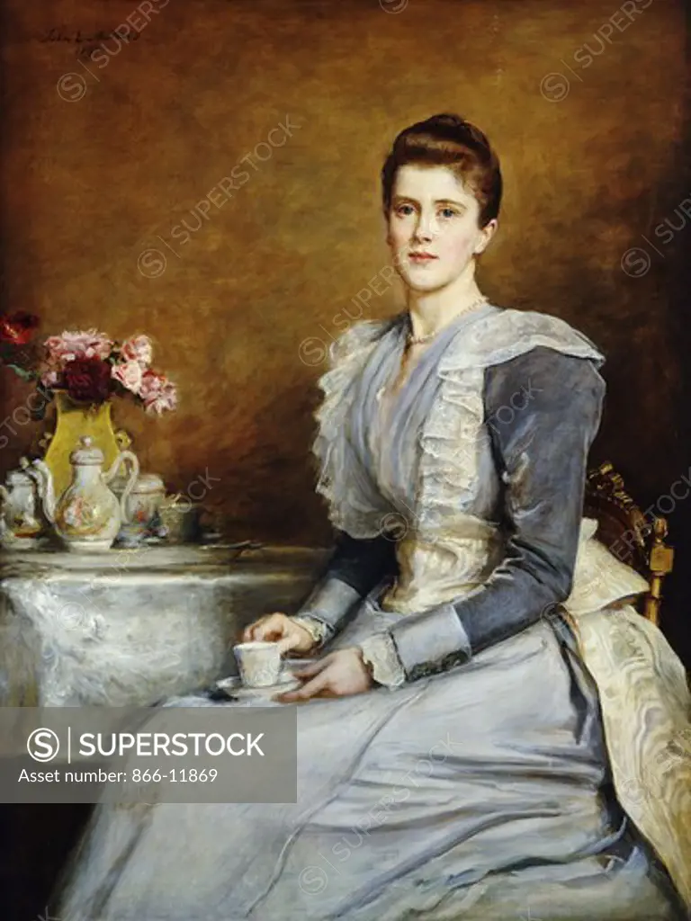 Portrait of Mrs. Joseph Chamberlain, seated three-quarter length at a tea-table, wearing a grey and white dress. Sir John Everett Millais (1829-1896). Oil on canvas. Signed and dated 1891. 132 x 79cm