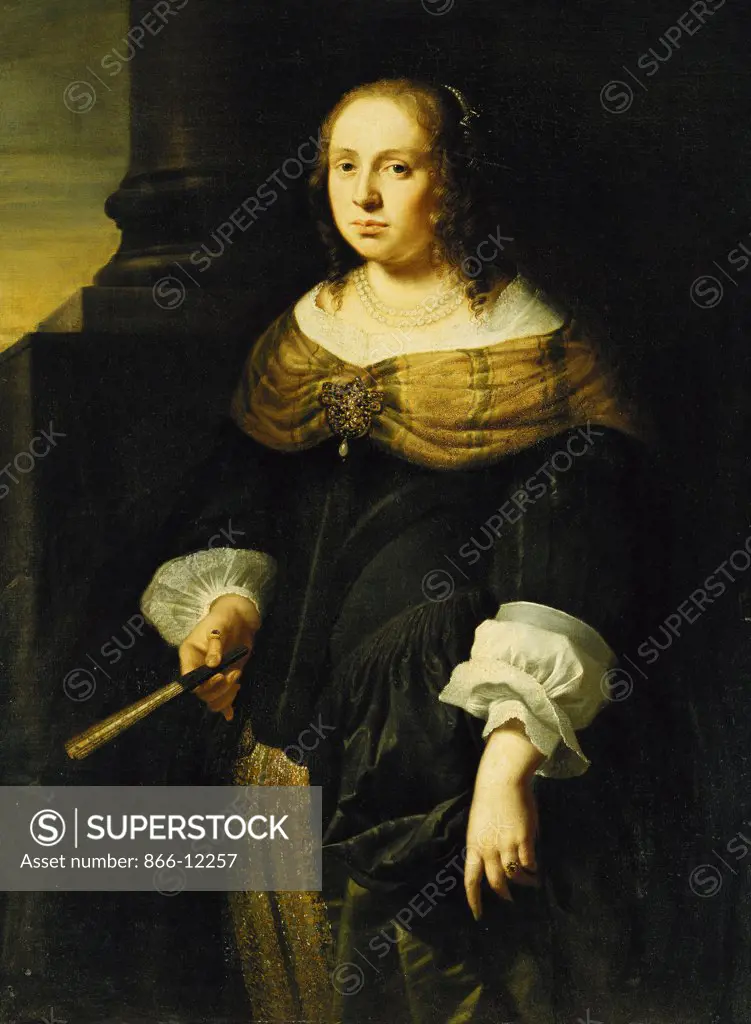 Portrait of a Lady, Three-Quarter Length, Wearing a Black and Green Dress, Holding a Fan, on a Portico. Ferdinand Bol (1616-1680). Oil on canvas. 113.7 x 83.8cm.