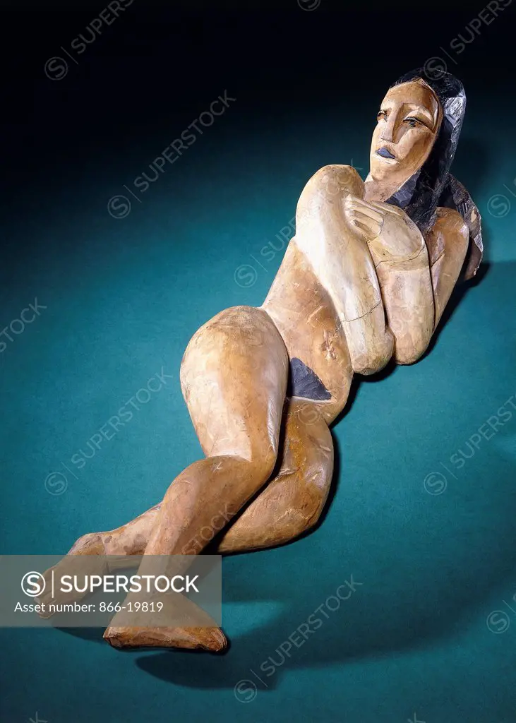 Reclining Nude; Liegende. Ernst Ludwig Kirchner (1880-1938). Hand-painted carved wood (chestnut). Executed circa 1911-1912. 68.5cm. long.