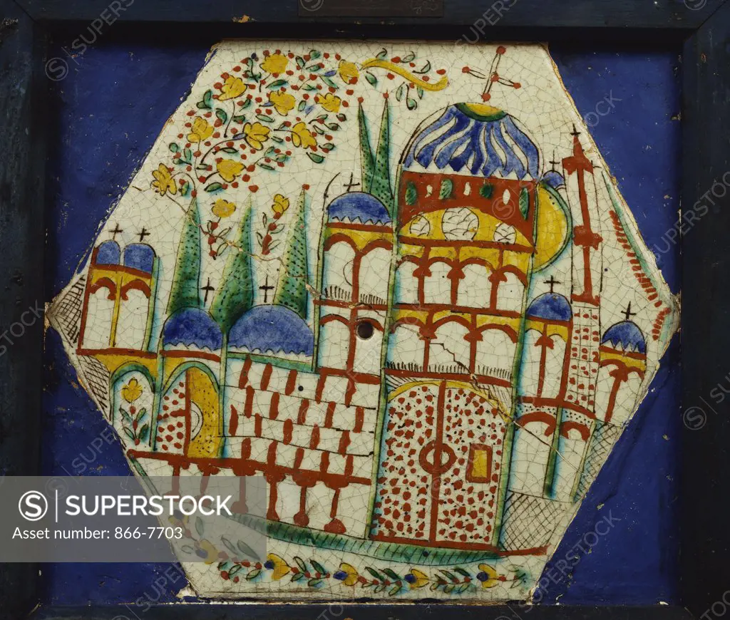 A kutahya pottery hexagonal tile depicting a cathedral with floral spray above. 18th century, 21.5cm across.