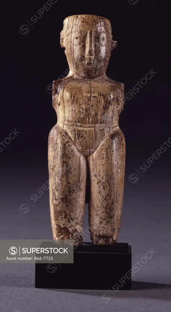 A Fatamid ivory male figurine with stocky body, lightly delineated loincloth and large head carved with almond shaped eyes. Circa 11th century, 11.1cm high.
