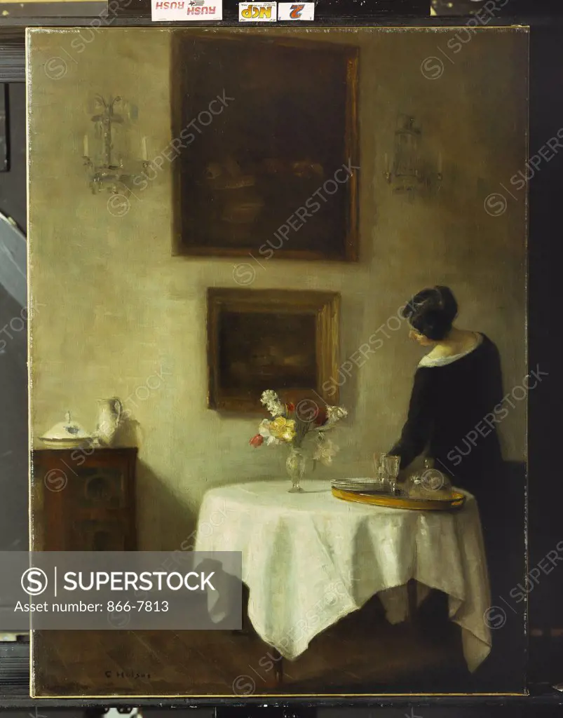 A Woman by a Dining Table.  Carl Holsoe (1863-1935). Oil on canvas, 95.2 x 71cm.