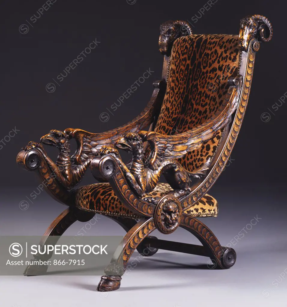 A German walnut armchair, the rectangular padded back and bowed seat covered in simulated leopard-skin.