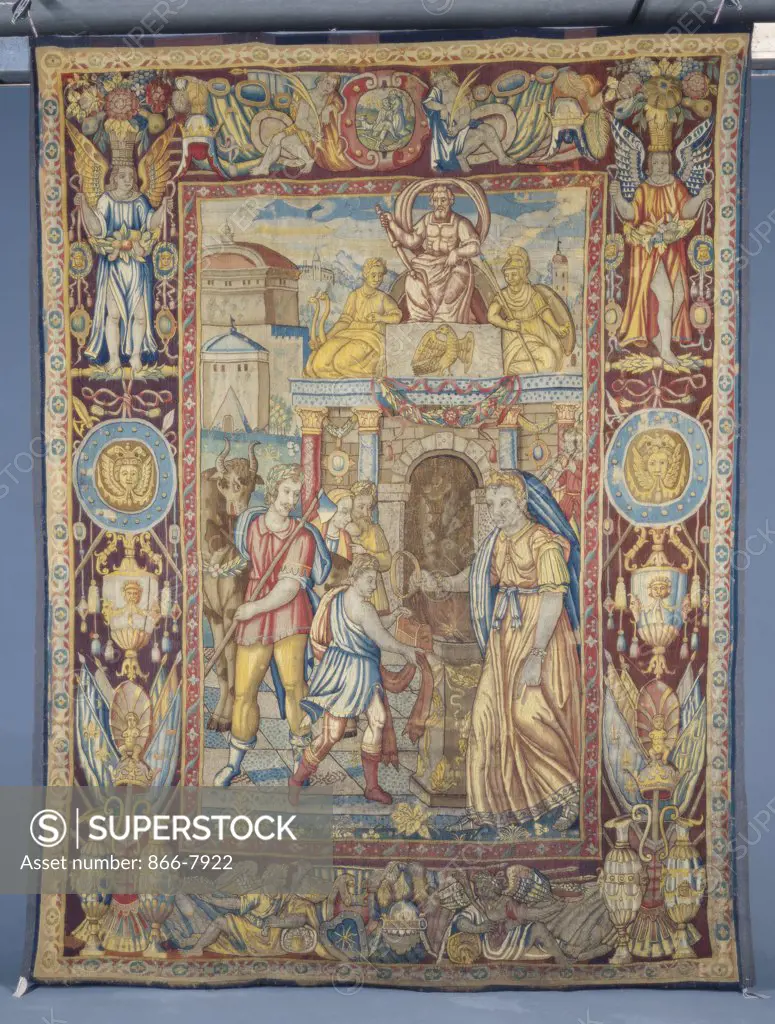 A Bruges tapestry, woven in wools and silks, depicting a Robed Figure, presenting an Offering of Thanksgiving to a High Priestess. Mid 16th century, 340 x 260cm.