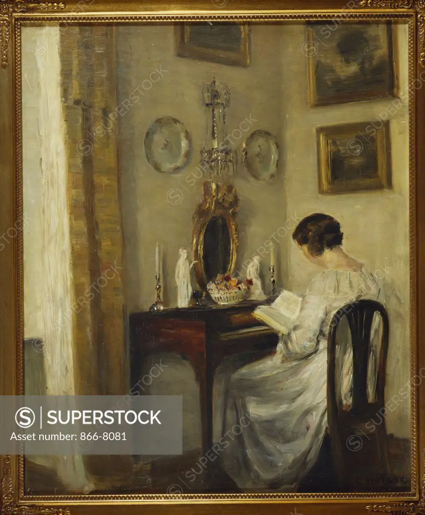 An Interior with a Girl Reading at a Desk. Carl Holsoe (1863-1935). Oil on canvas, 57.8 x 47.8cm.
