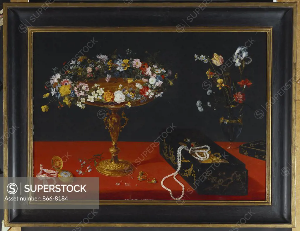 A Garland of Flowers in a Tazza, Jewels and Coins in a Japanese Black and Gold Lacquer Fumibako, an Iris and other Flowers in a Glass Ewer, and a Verge Watch and Rings on a Draped Table. Jan Brueghel the Younger (1601-1678). Oil on panel, 47.5 x 66.5cm.