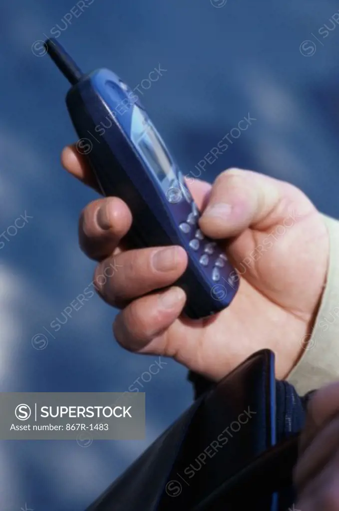Person operating a mobile phone