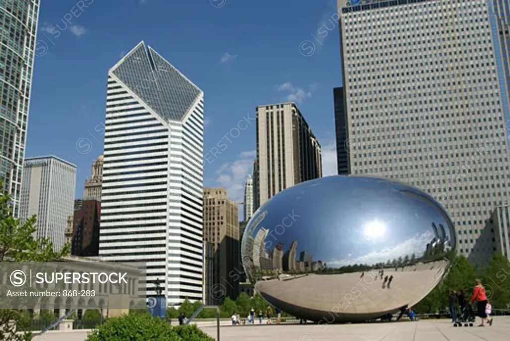 Low angle view of a sculpture and skyscrapers, Cloud Gate, Millennium Park, Chicago, Illinois, USA