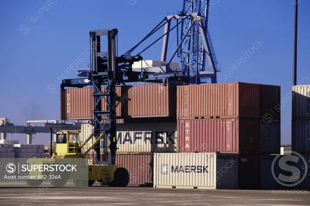 Crane and cargo containers at a commercial dock